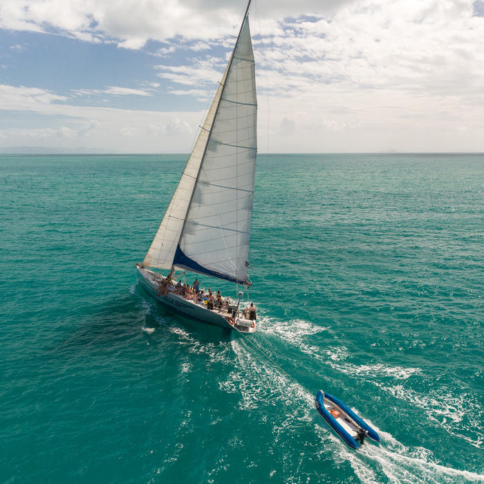 British Defender - Aerial Sailing from Stern - Explore Whitsundays.jpg